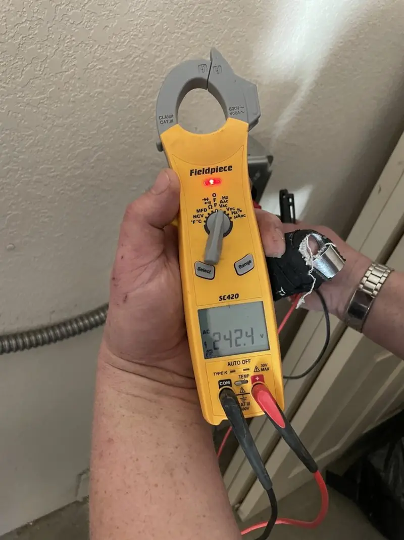 Voltage testing with clamp meter during Electrical Installation Services in Hallandale Beach